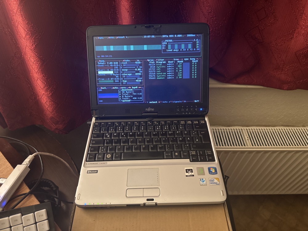 The Fujitsu LifeBook T4410 running btop on FreeBSD